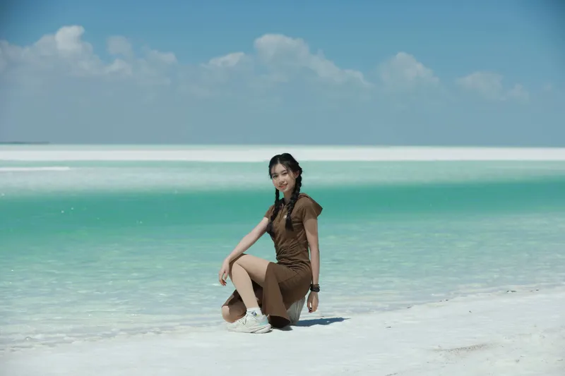 她